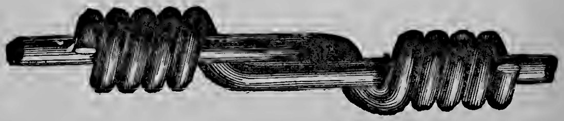 A wire splice: how the two ends of a broken line were rejoined, each wire wound firmly around the other.